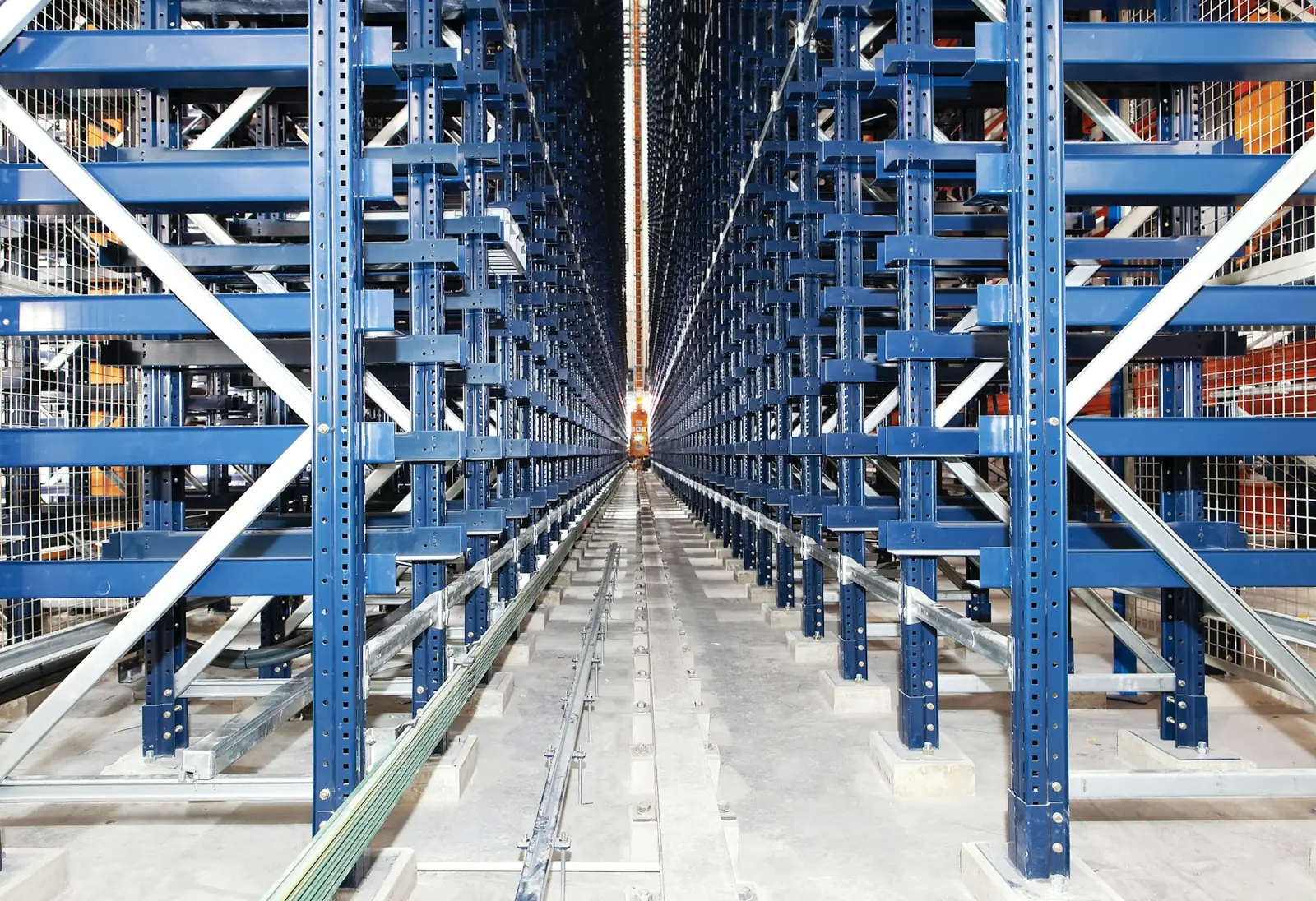 Long aisle of blue steel automated storage racking